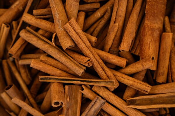 cinnamon sticks background 1 scaled