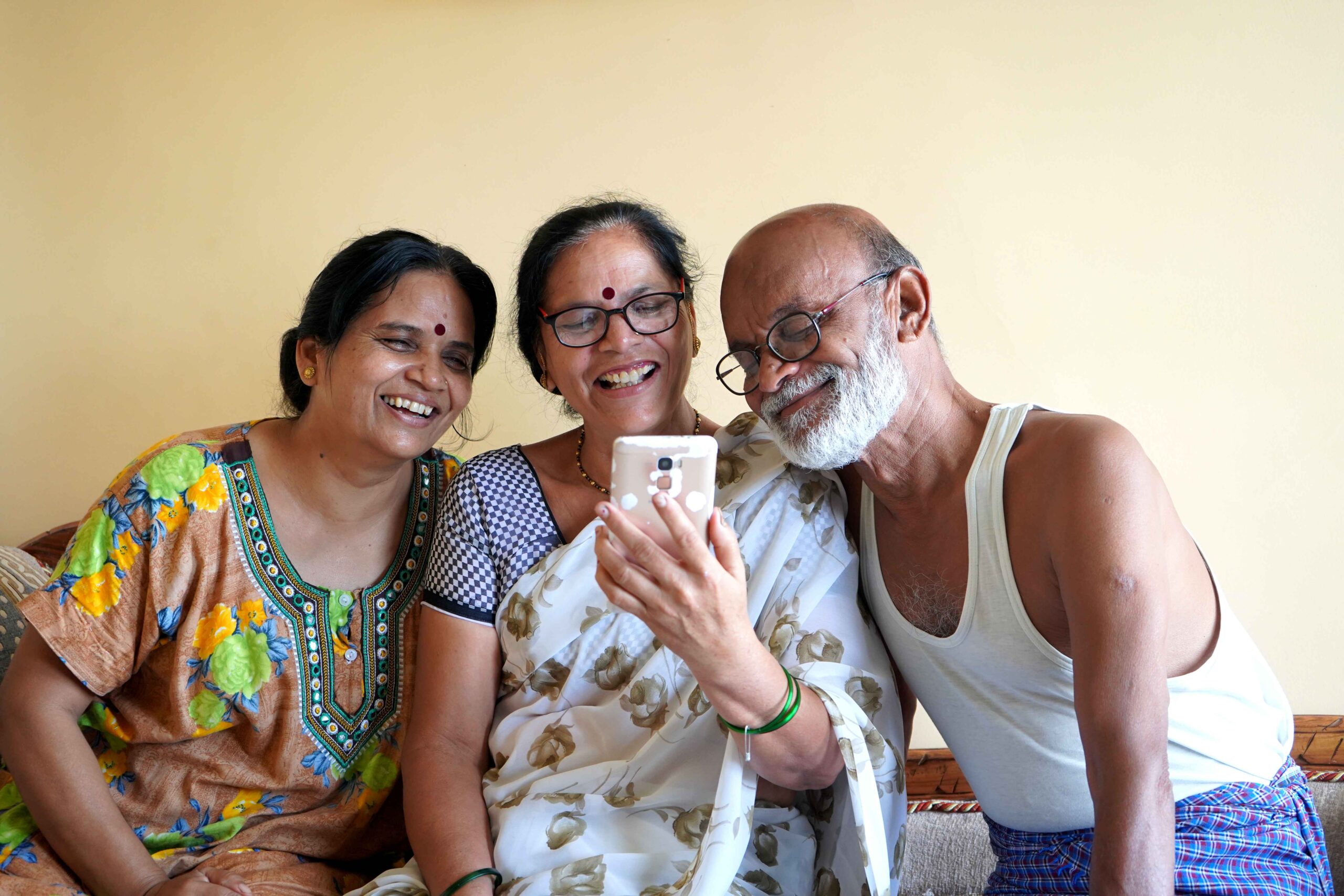 indian family chatting on phone at home 2023 11 27 05 21 38 utc 1 scaled